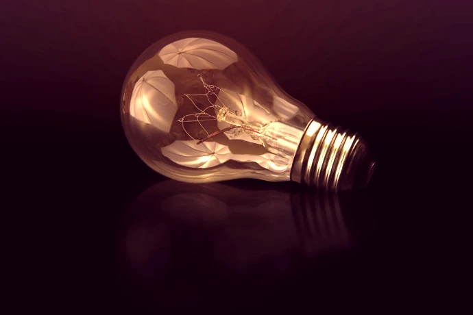 incandescent bulb on black surface